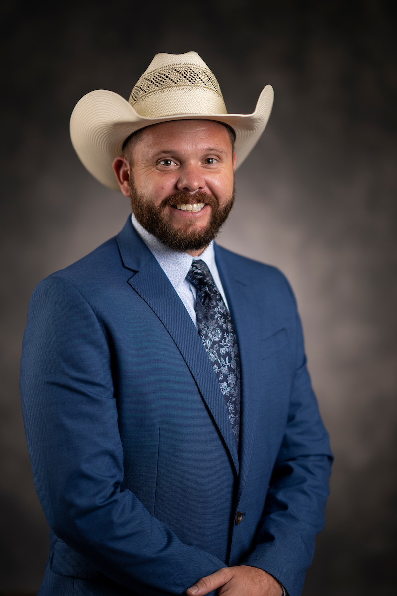 Cody Maxwell wearing a cowboy hat and blue suit